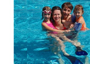 Happy family in the pool