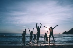 Family on the beach with sunset