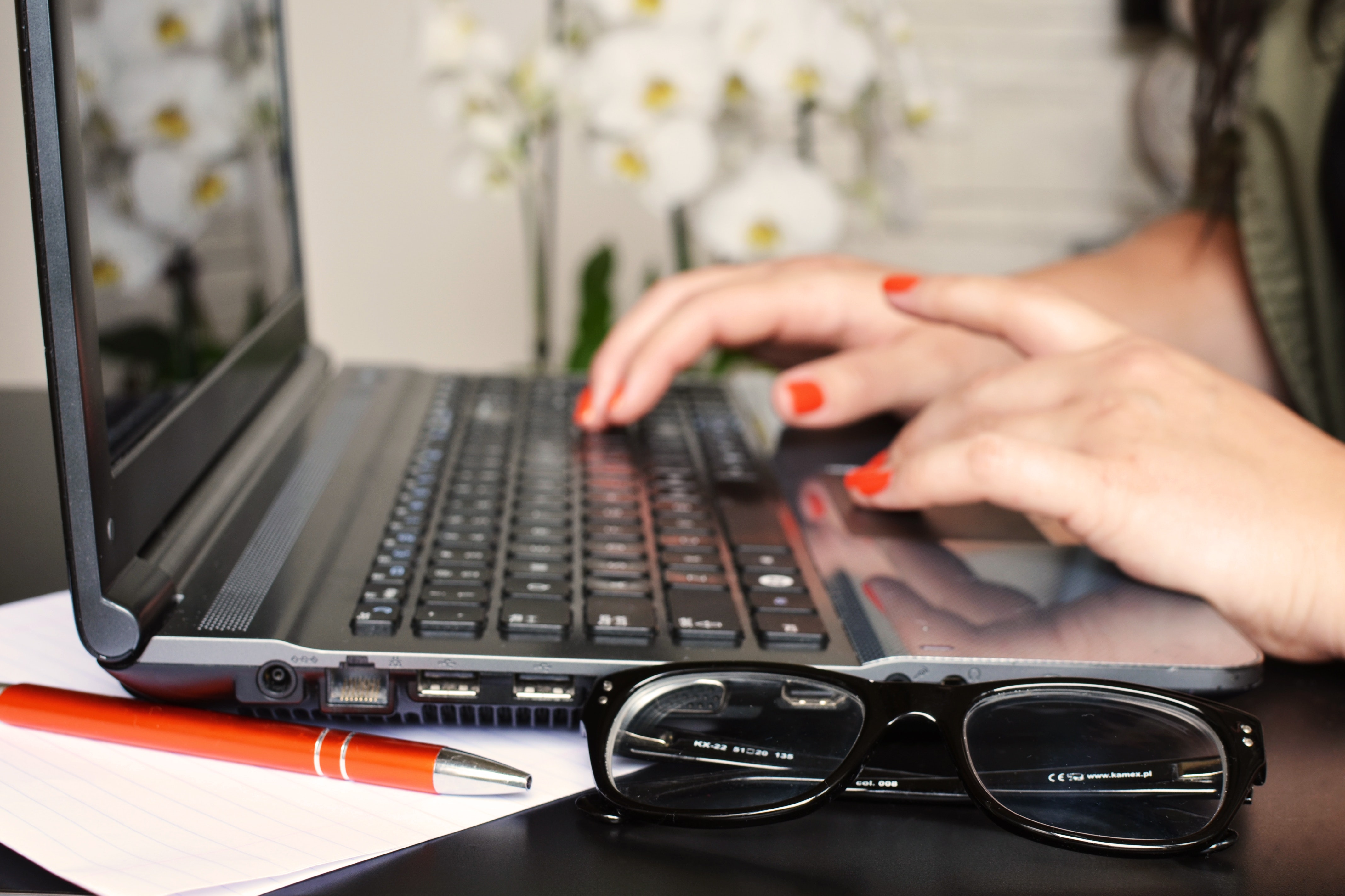 hands typing on keyboard