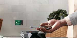 man using tap-to-pay with rewards mastercard