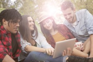 teens using tablet - mobile banking