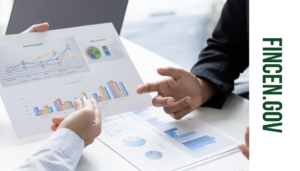 People discussing charts and graphs - link to FINCEN.Gov