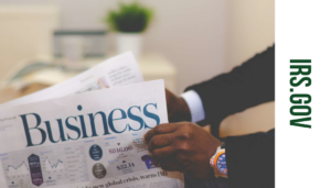 Person holding a Business Newspaper - link to IRS.Gov