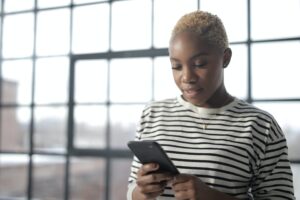 woman on phone using digital banking app
