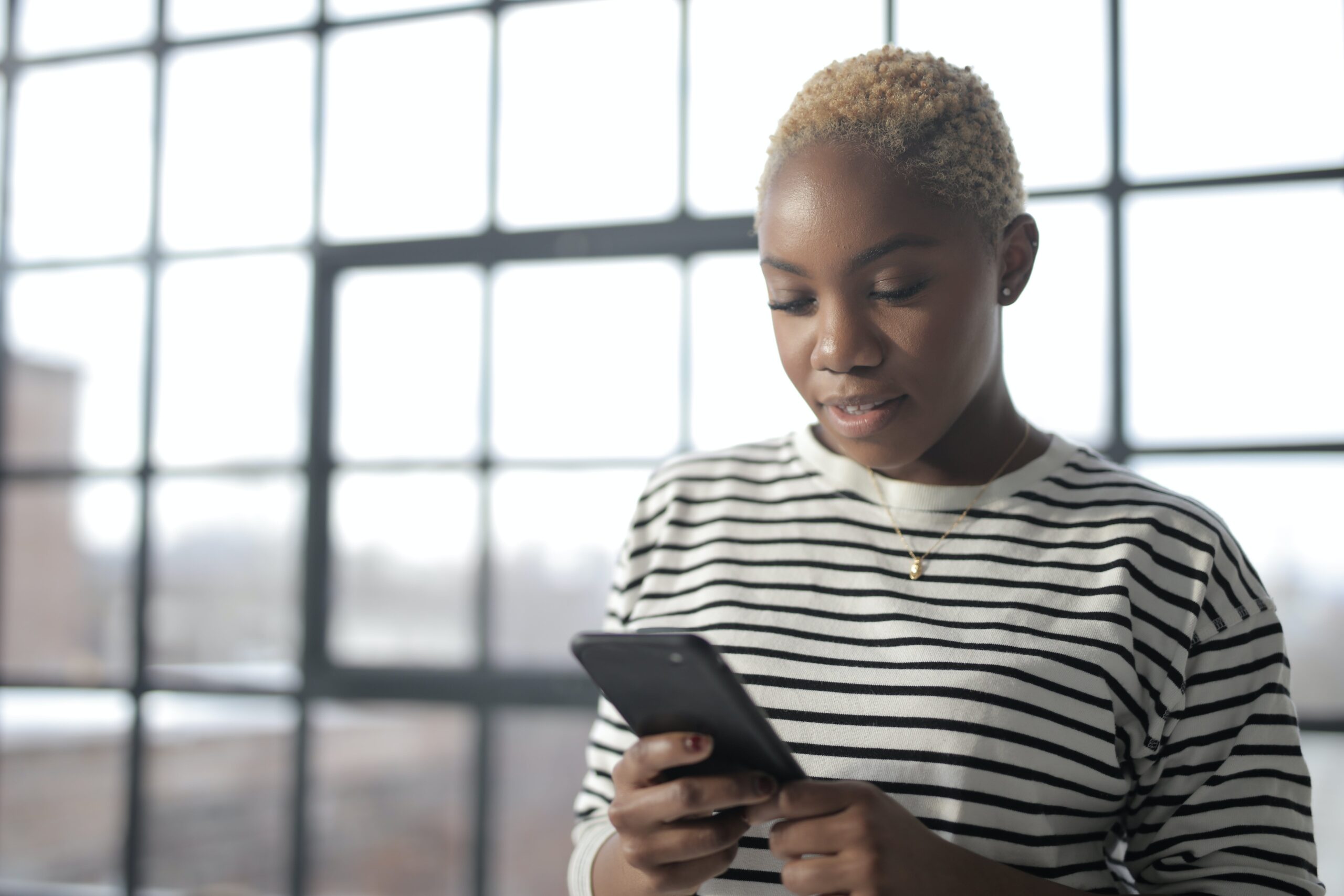 woman on phone using digital banking app